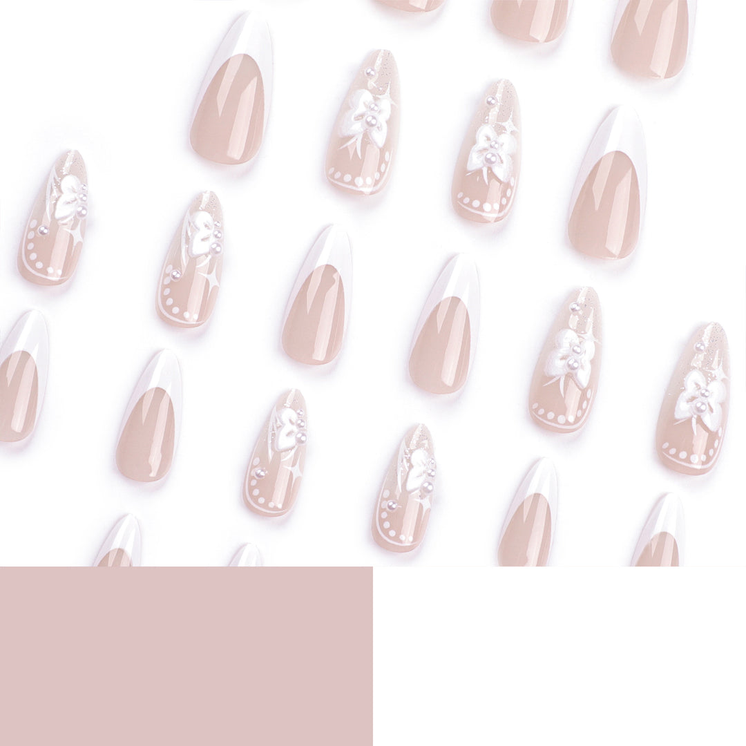 Artful stiletto nails with floral designs and glitter accents Stornfield