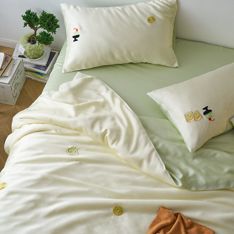 Reversible cotton satin bedding set with fitted sheet and subtle embroidery appliqués