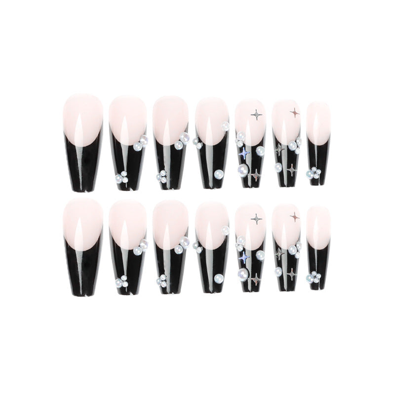 Artificial nail art with pearl and shine elements Stornfield
