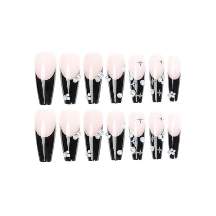 Artificial nail art with pearl and shine elements Stornfield