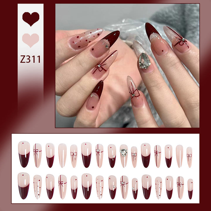 Artificial nail set with elegant bow and glitter details Stornfield