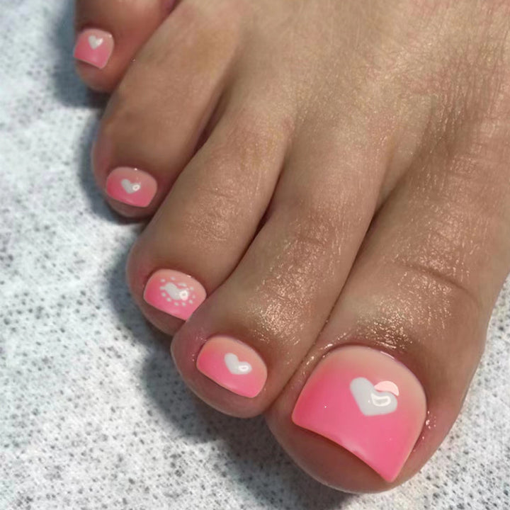 Artful toenail design with heart motifs Stornfield
