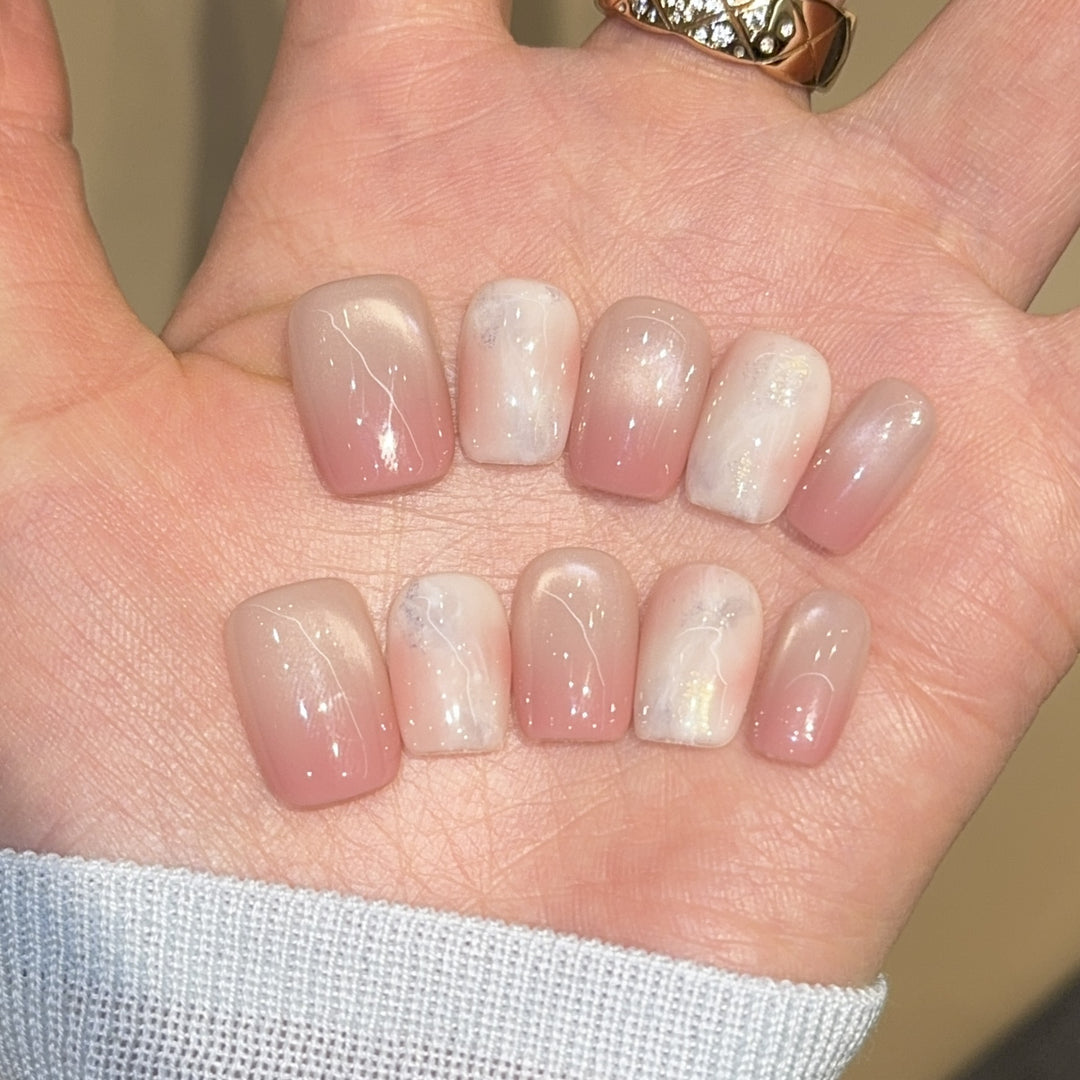 Artificial nails with elegant gradient colors and holographic accents Stornfield