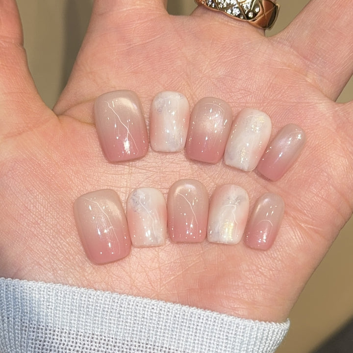 Artificial nails with elegant gradient colors and holographic accents Stornfield