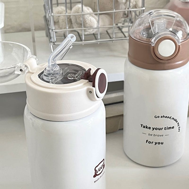 Women's insulated drinking bottle with innovative flip lid and practical handle Stornfield