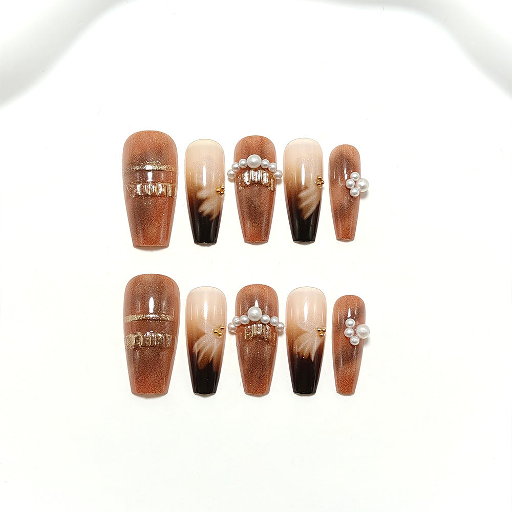 Artificial nails with elegant pearl and gold accents Stornfield