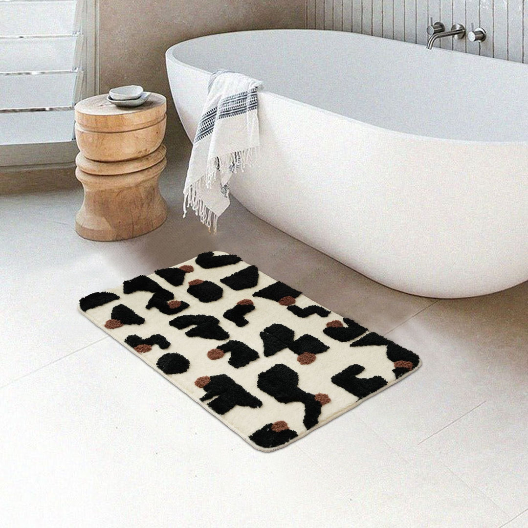 Tufted bathroom mat in abstract leopard pattern with soft high pile Stornfield