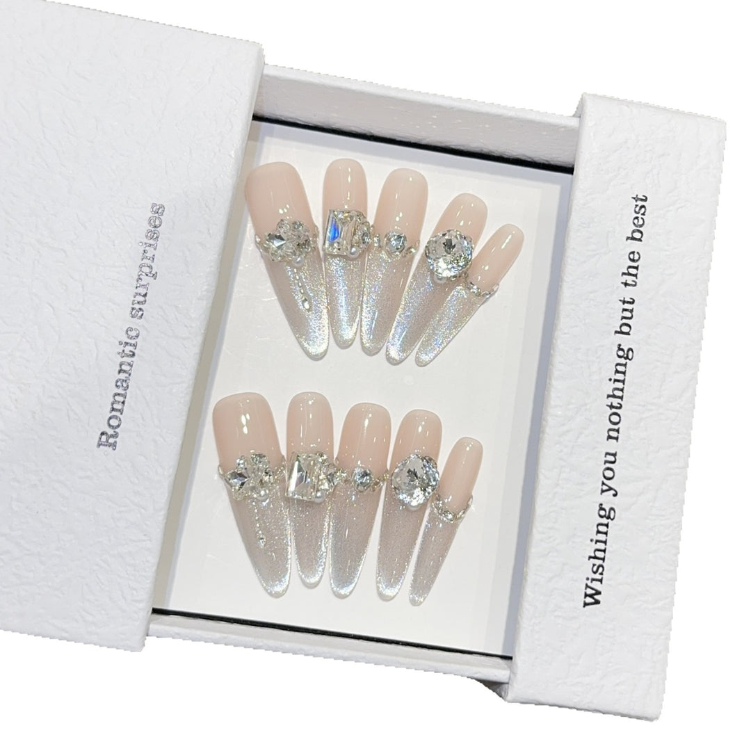 Glamorous artificial nails with sparkling rhinestone embellishments Stornfield