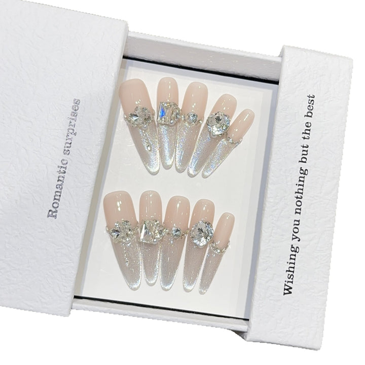 Glamorous artificial nails with sparkling rhinestone embellishments Stornfield
