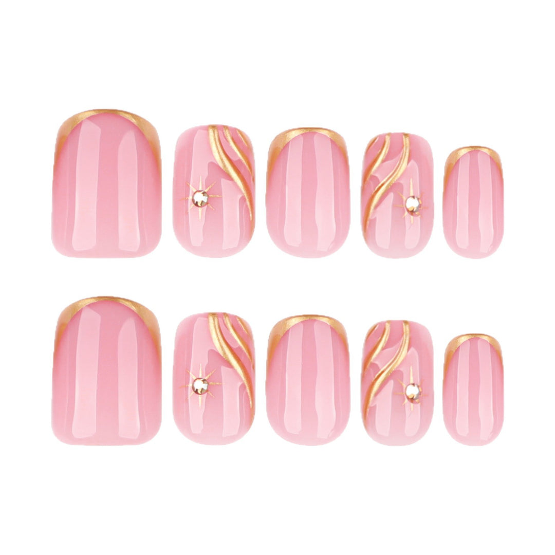 Artificial nail art with glamorous golden accents Stornfield
