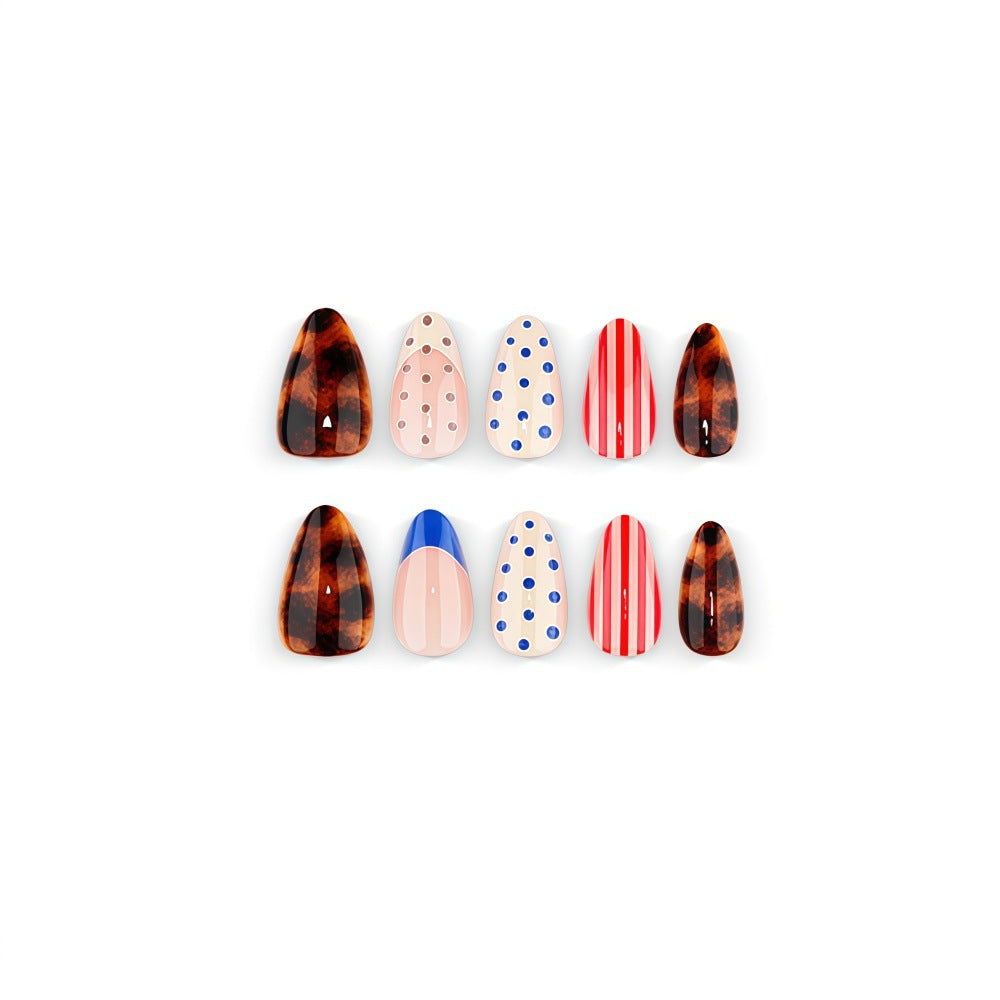 Fake nails in playful design with dots and stripes Stornfield