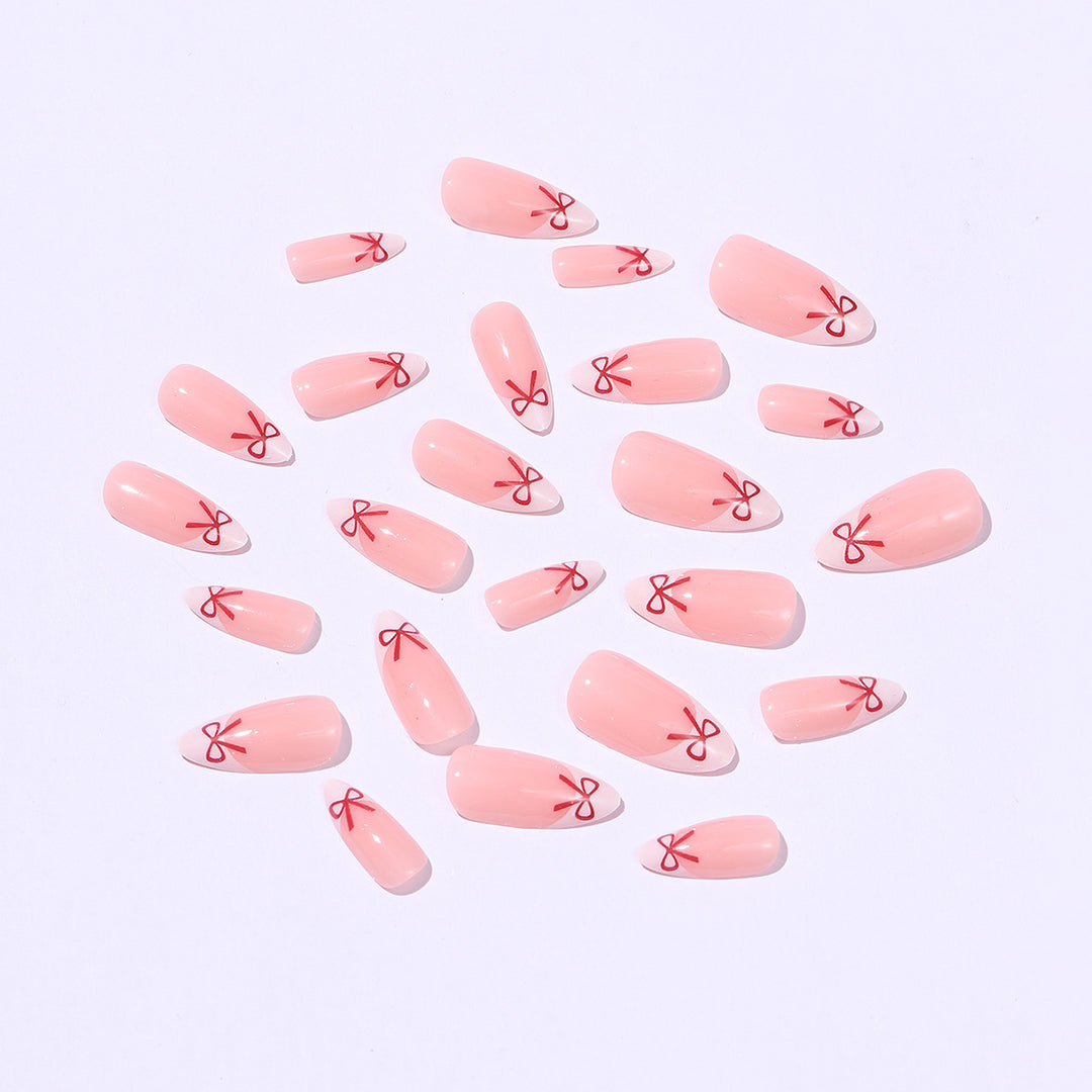 Artificial nail set with playful bow design Stornfield