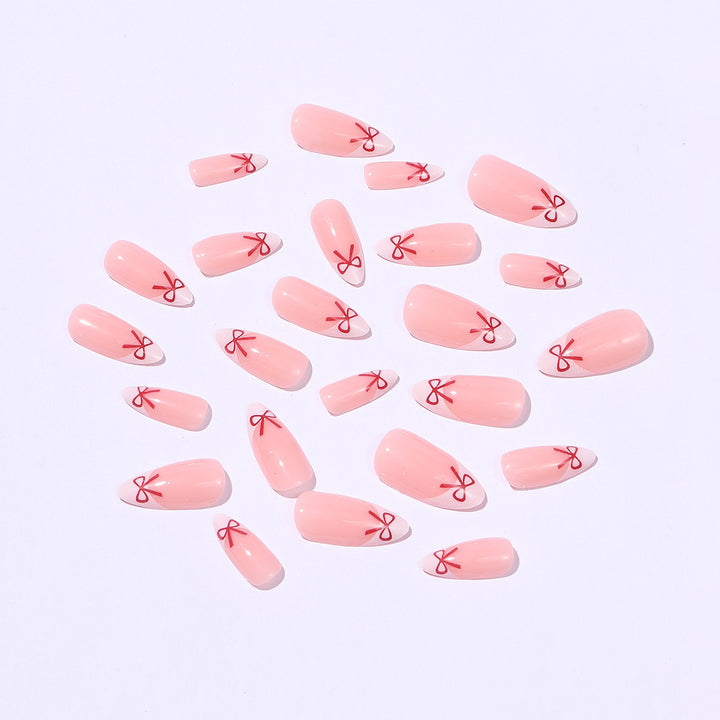 Artificial nail set with playful bow design Stornfield