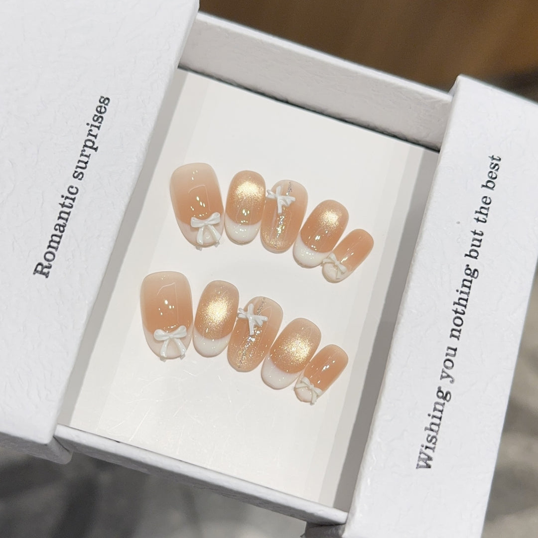 Artificial nails with romantic bow and glitter effects Stornfield