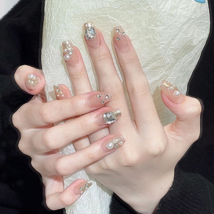 Artificial nail set with elegant pearl and glitter design Stornfield