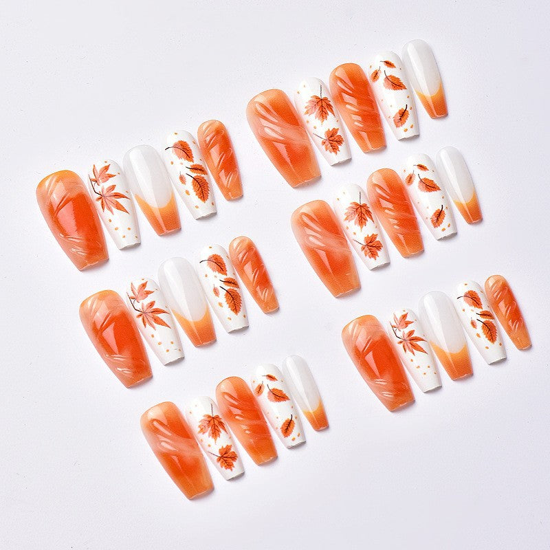 Acrylic nail set with elegant autumn motifs and shiny accents Stornfield
