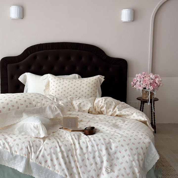 Luxurious cotton satin bed linen set in vintage style with delicate floral pattern and lace trim