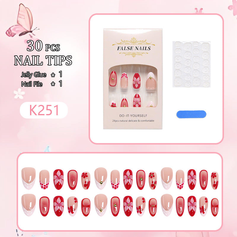 Artificial nails with floral design and glamorous accents Stornfield