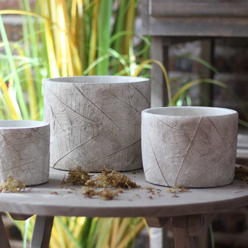 Decorative plant container made of handmade ceramic with leaf pattern Stornfield