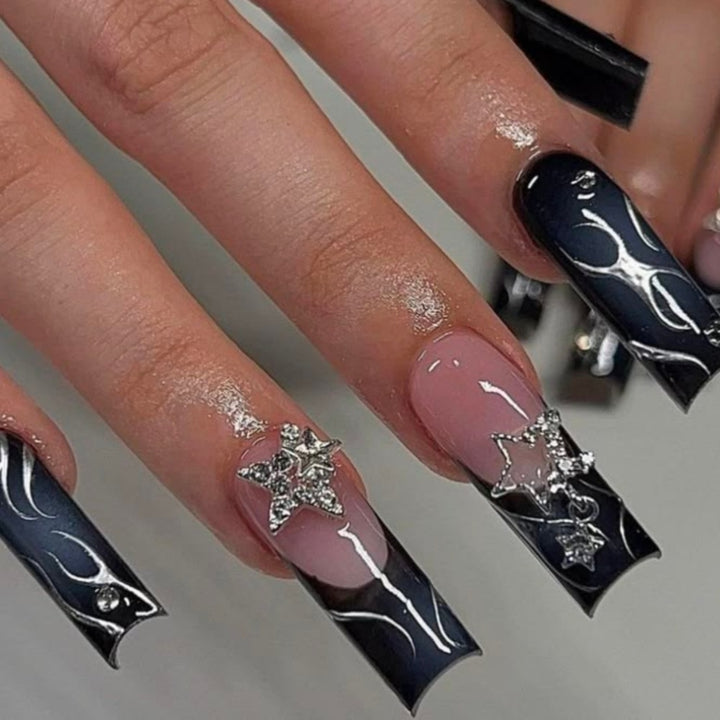 Artificial nails with elegant glitter accents and heart motifs Stornfield