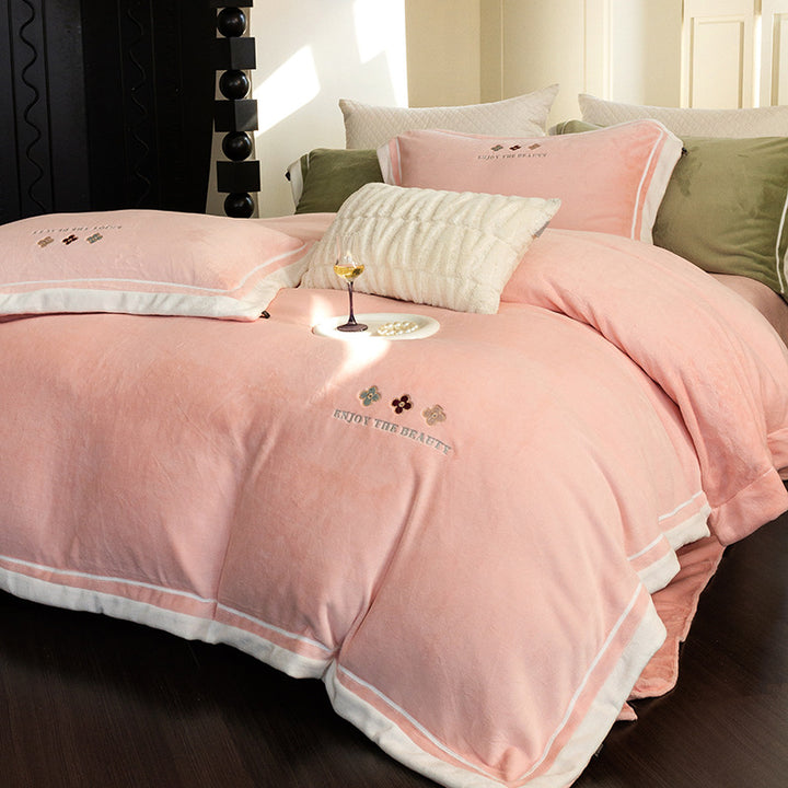 Velvety duvet cover set with embroidered floral design and contrasting piping