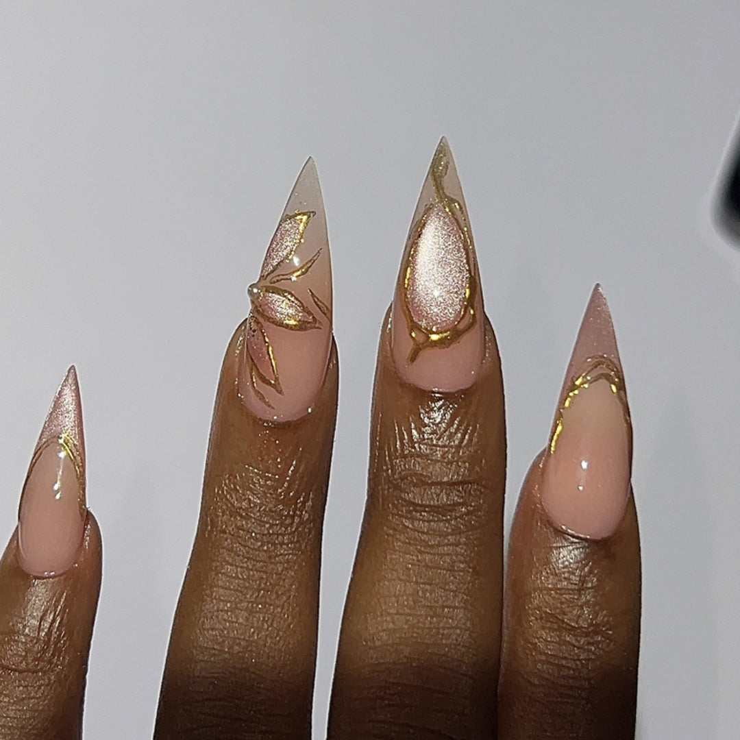 Artful Stiletto Nails with Gold Accents Stornfield