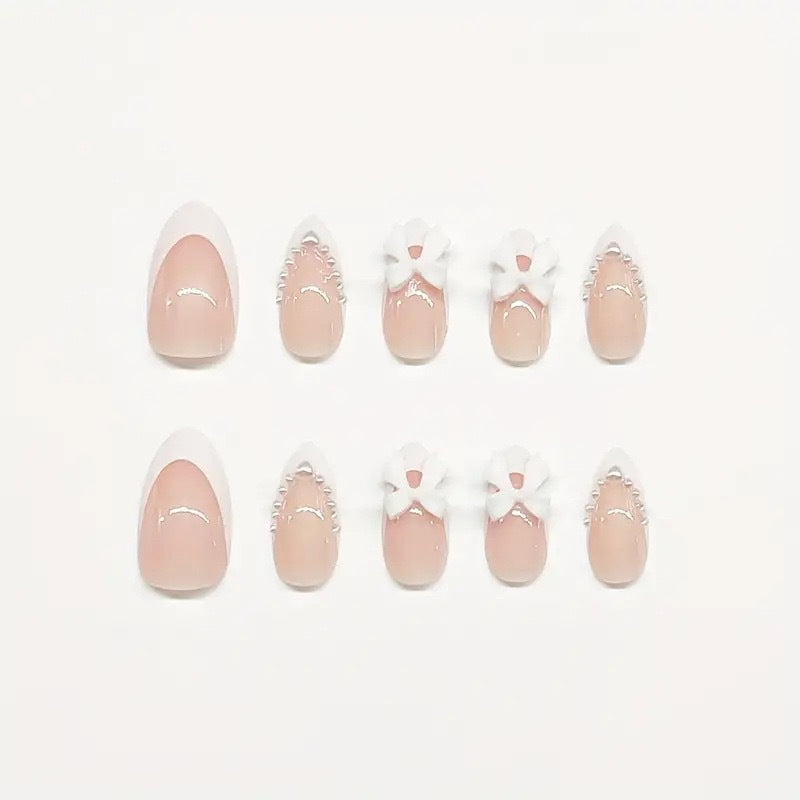 Artistic Press-On Nail Design with Bow Accents Stornfield
