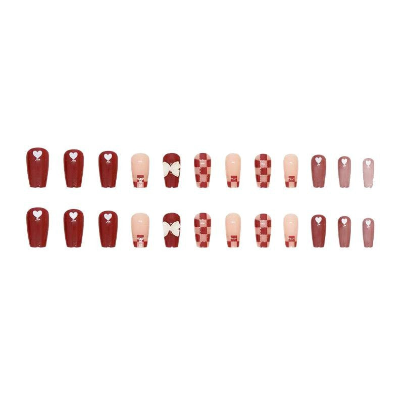 Artificial nails with decorative heart and bow details Stornfield