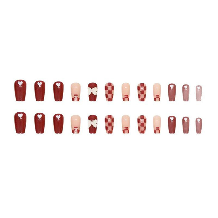 Artificial nails with decorative heart and bow details Stornfield