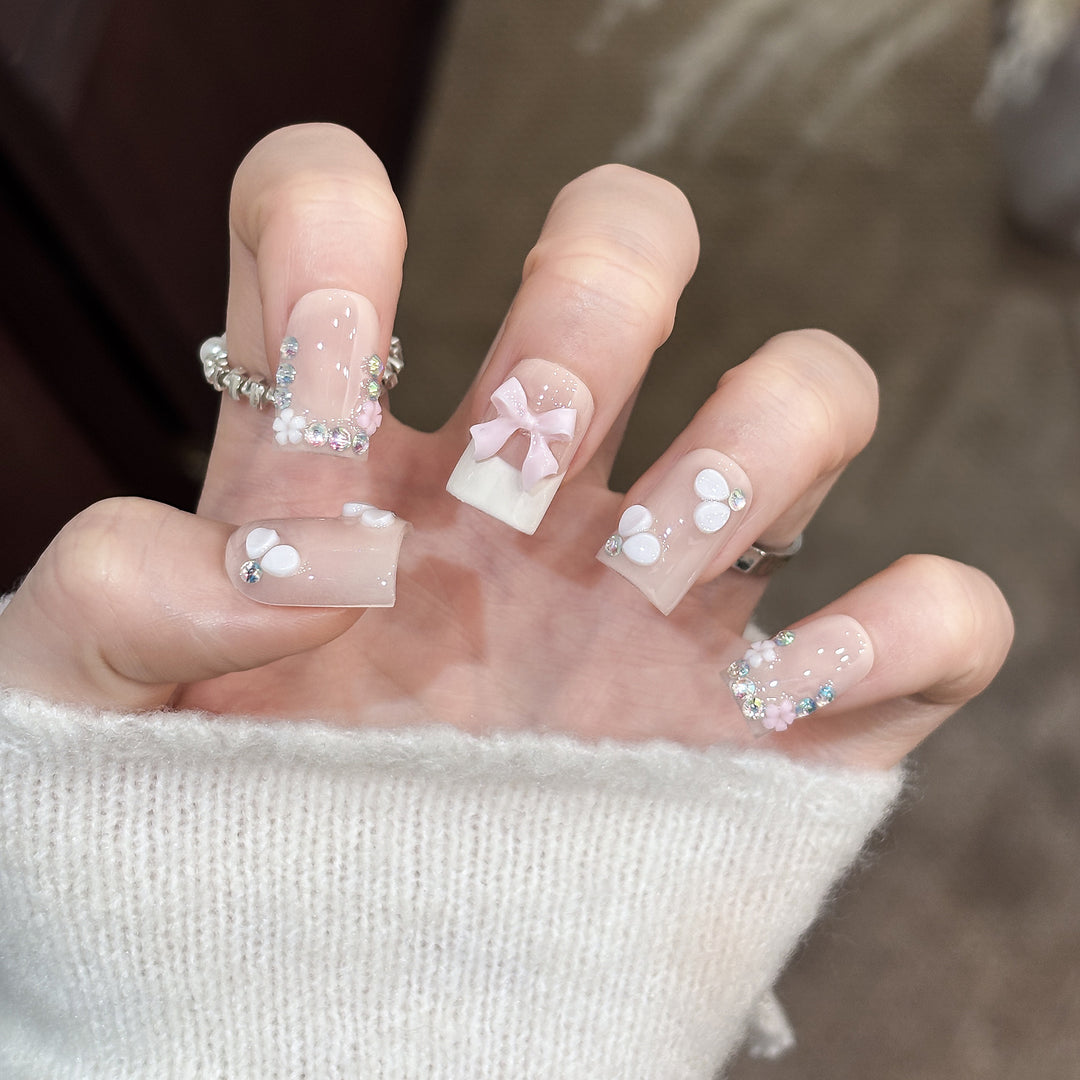 Decorative Nail Art Set with Floral Details and Bow Accents