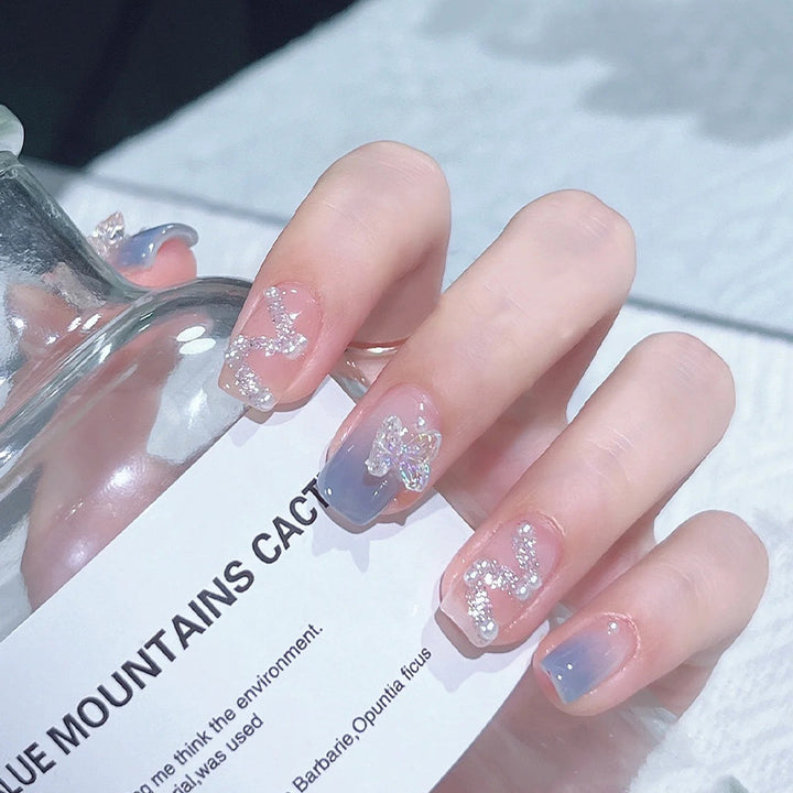 Acrylic nail set with sparkling glitter elements and appealing ombre design Stornfield