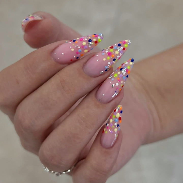 Acrylic nail set with colorful glitter dots and elegant tips Stornfield