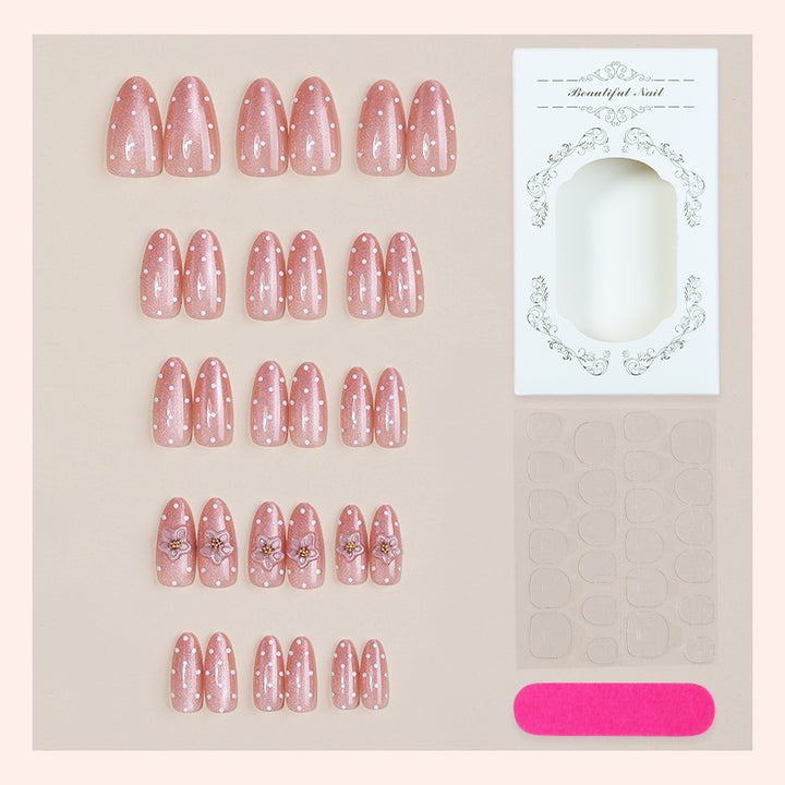 Artificial nail set with glitter and delicate floral and rhinestone embellishments Stornfield