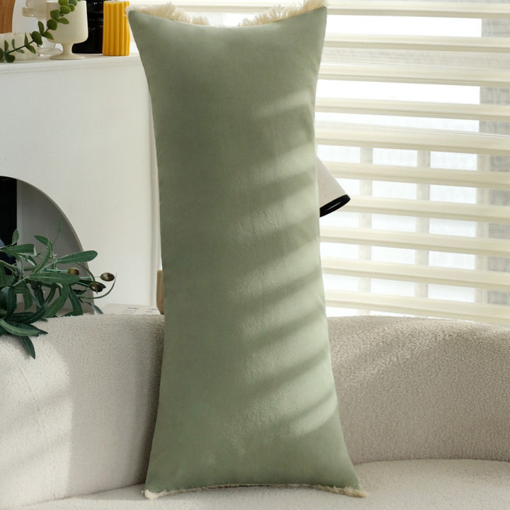 Long decorative cushion with fringe edge