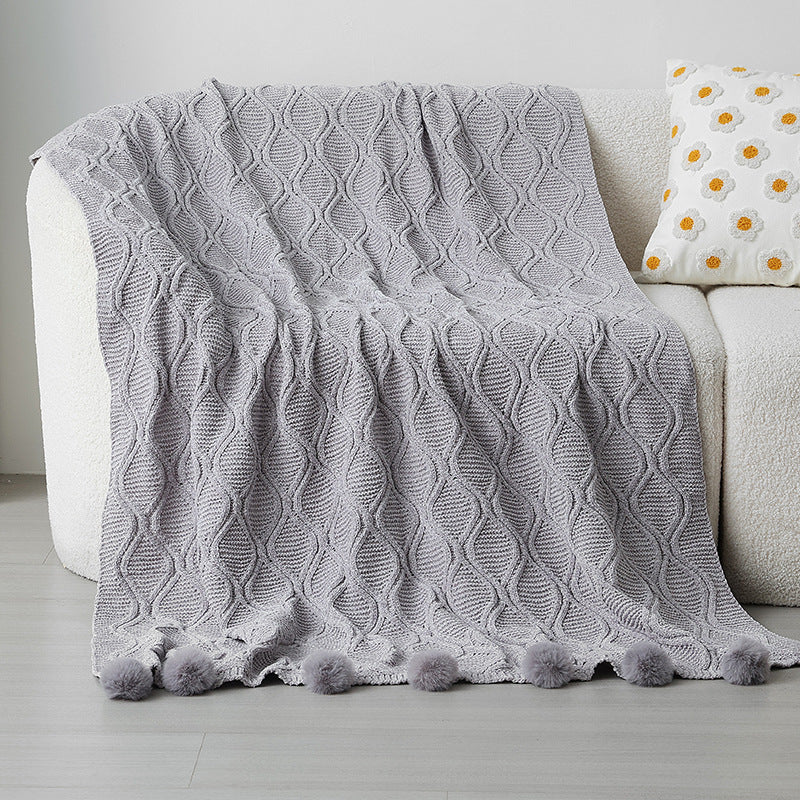 Ladies knit blanket with decorative pom poms Stornfield