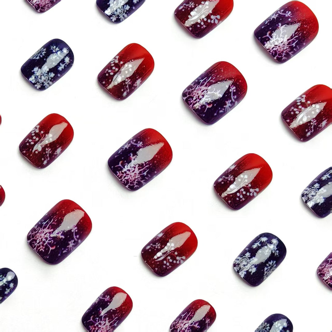 Artificial nails with festive glitter effect and wintry snow motif Stornfield