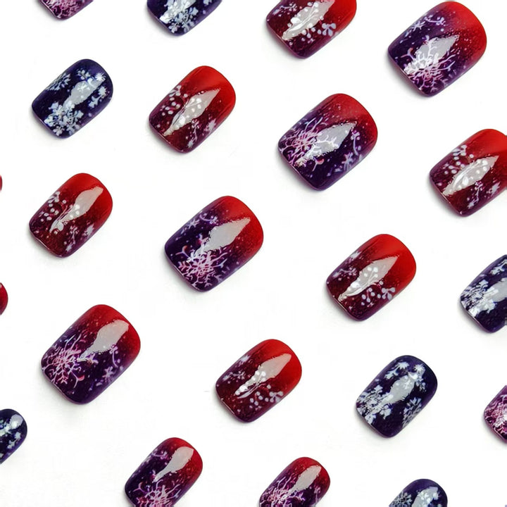Artificial nails with festive glitter effect and wintry snow motif Stornfield