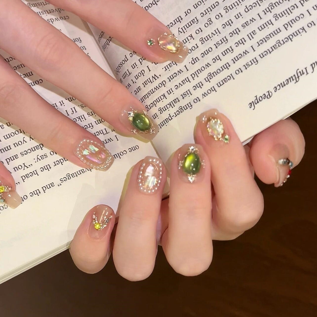 Artificial nails with rhinestone and pearl accents Stornfield