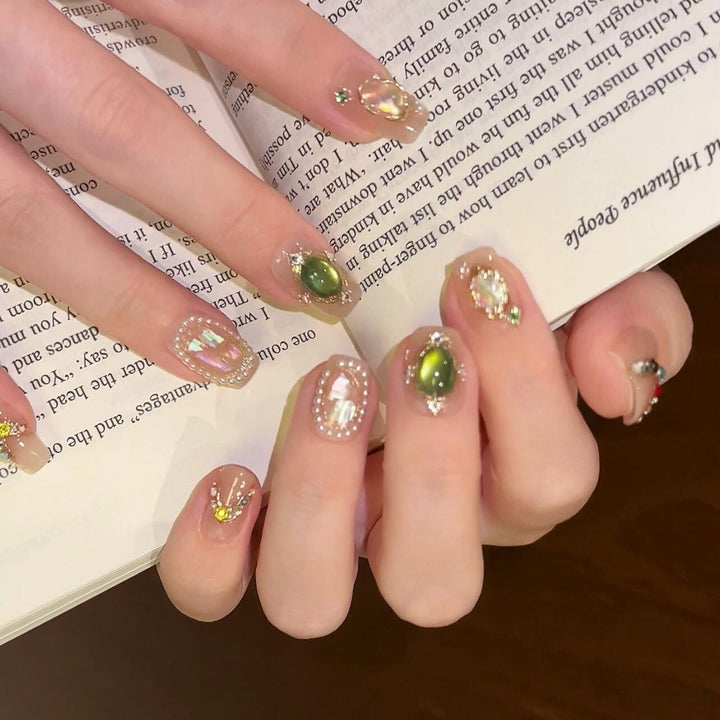 Artificial nails with rhinestone and pearl accents Stornfield