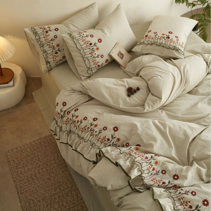 Cotton-linen duvet cover set with fine pinstripe texture, floral embroidery and curved frill
