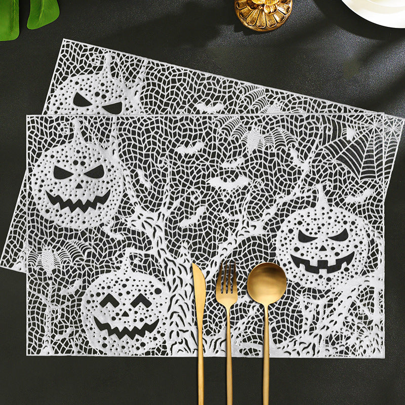 Halloween plastic table mats with intricate pumpkin and spider web design