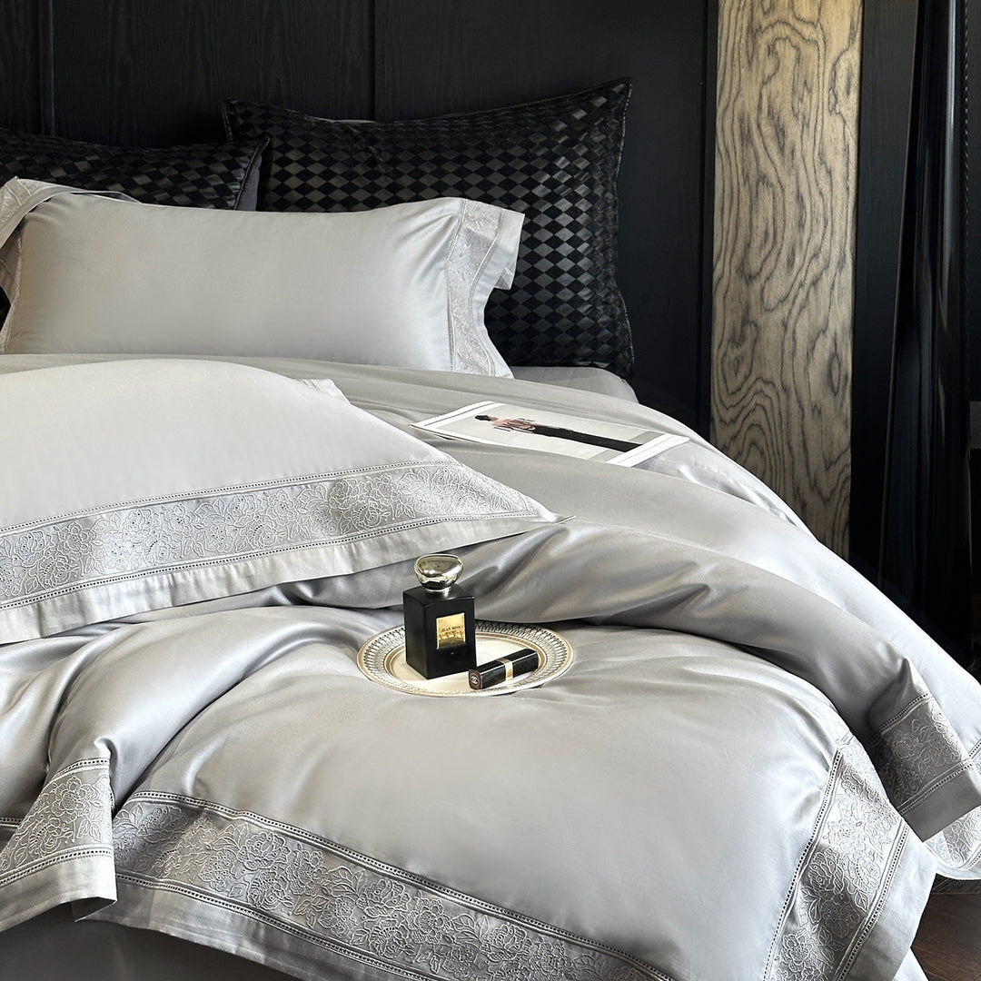 Premium cotton satin bedding set with integrated lace trim and delicate floral embroidery