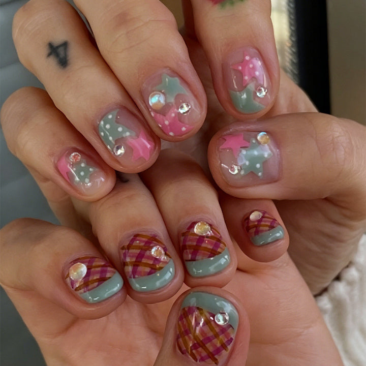 Artificial nail set with playful geometric designs and glitter accents Stornfield