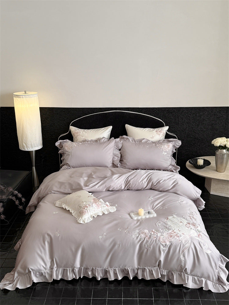 Luxurious satin bedding set with floral embroidery, ruffled edge and silky-matte finish Stornfield