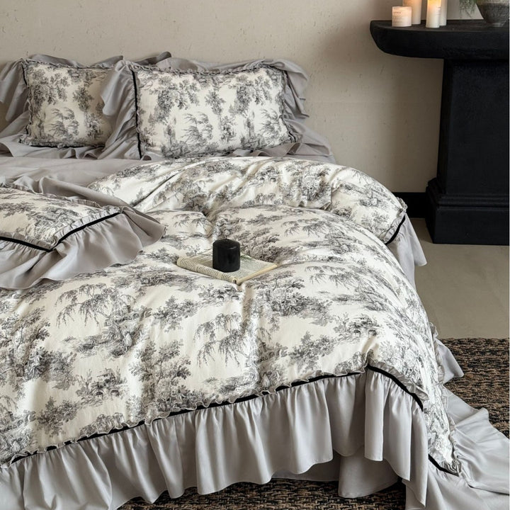 Bedding set with ruffles and toile pattern