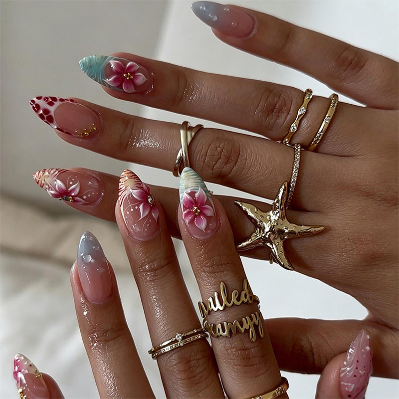 Artificial nail set with floral designs and glamorous accents Stornfield