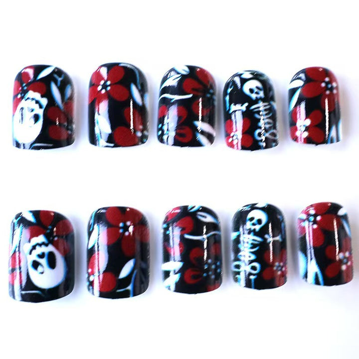 Artificial nail set with creepy skull design and floral accents Stornfield
