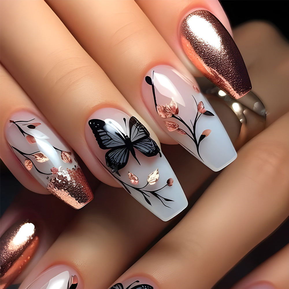 Artificial nails with filigree butterfly design and golden accents Stornfield