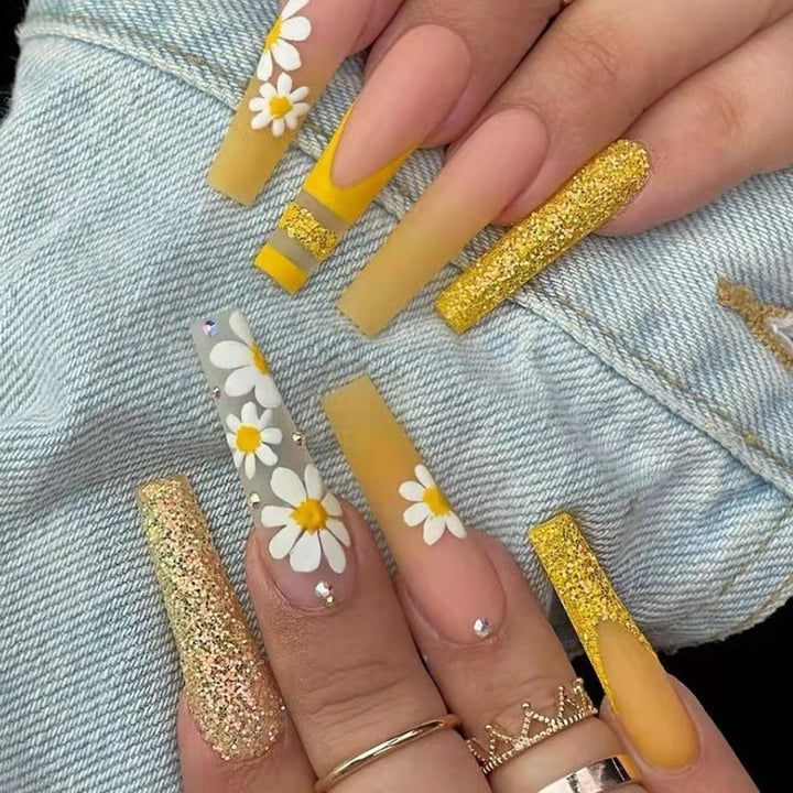 Artificial nail set with colorful sunflower designs and glittering accents Stornfield