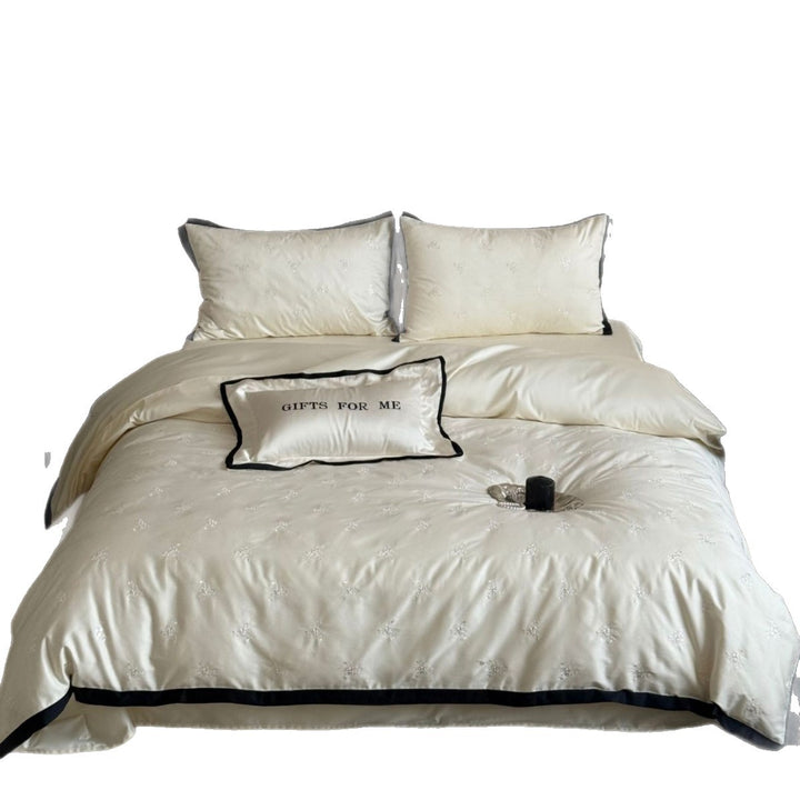 Noble cotton satin bedding set with tone-on-tone floral embroidery and contrasting piping